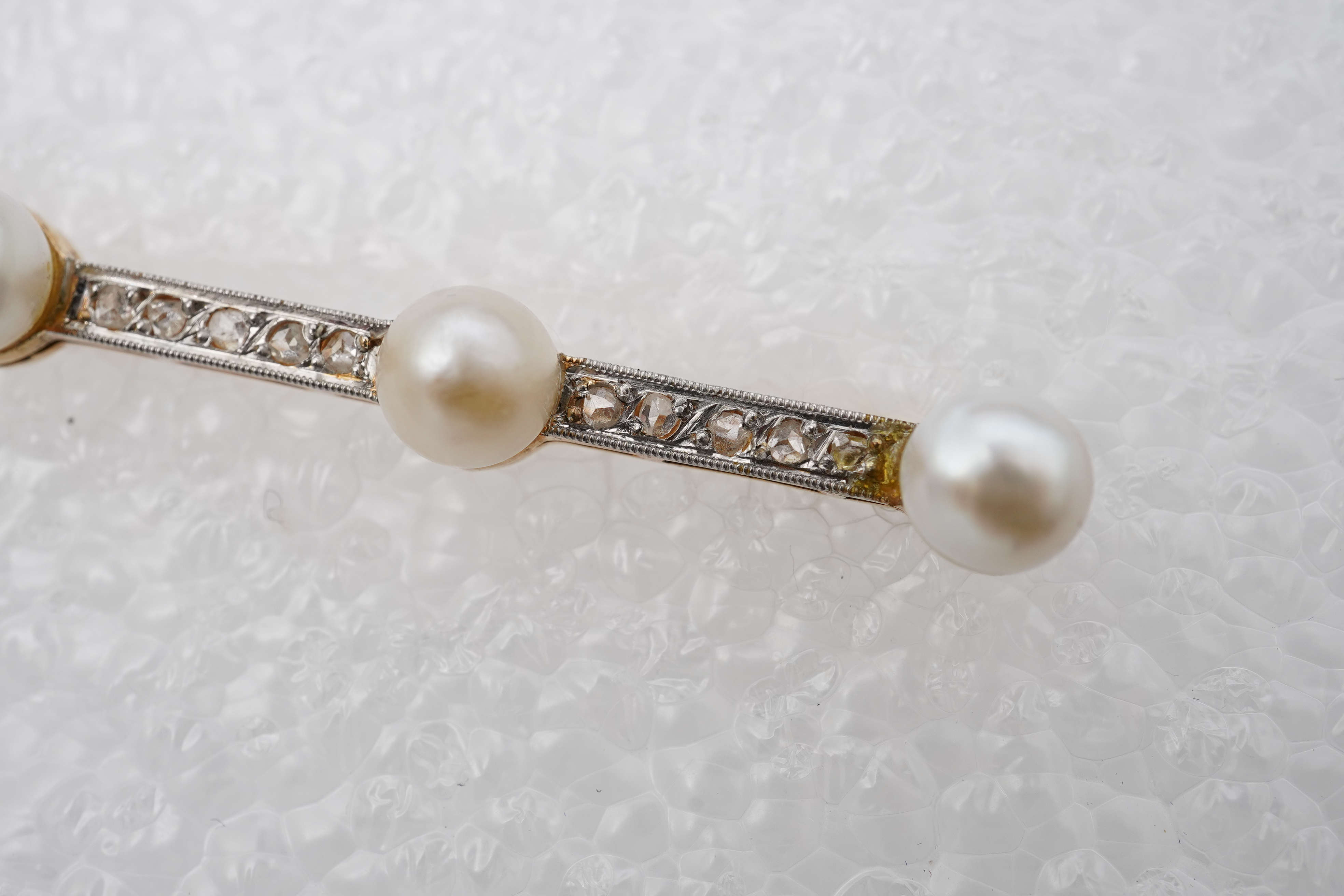 A pearl and diamond bar brooch, France, early 20th century